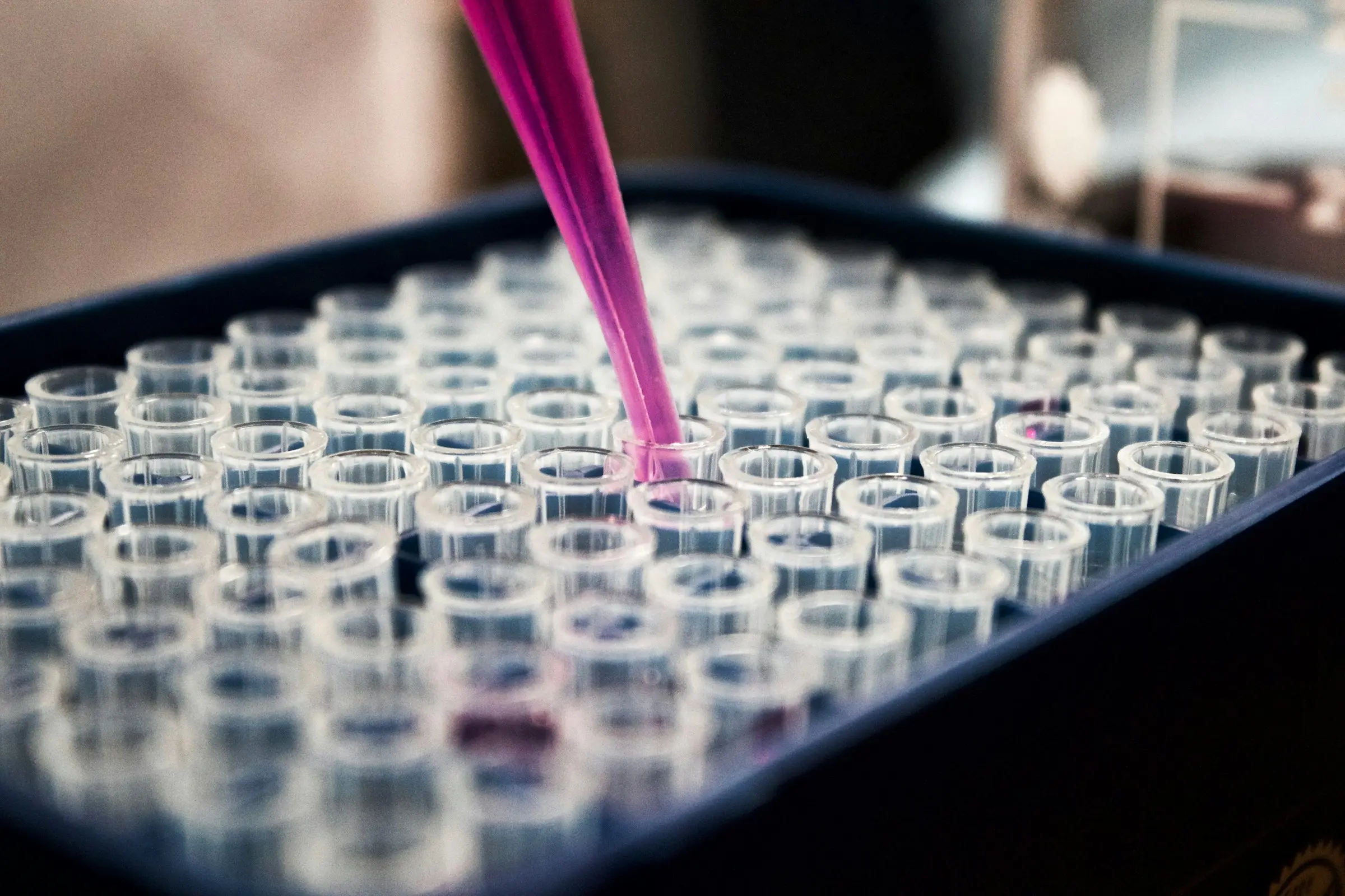 Technician testing spice samples in a quality-control laboratory